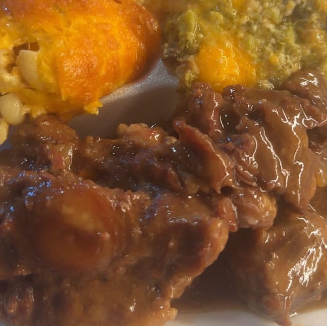 Oxtails with 2 Sides.